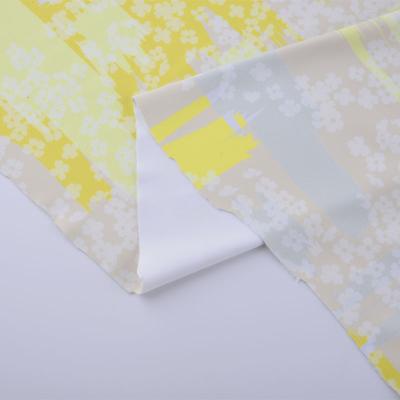 China Polyester Waterproof Stretch Fabric Knit Print Flower Women's Clothing Fabric For Knitting Print Daisy Floral Fabrics For Dresses yellow for sale