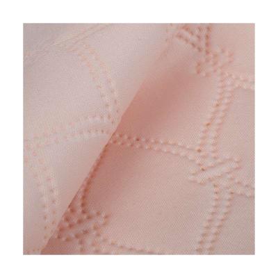 China Breathable Wholesale High Quality Pink Customized Spandex Embossed Polyester Embossed Knit Fabric for sale