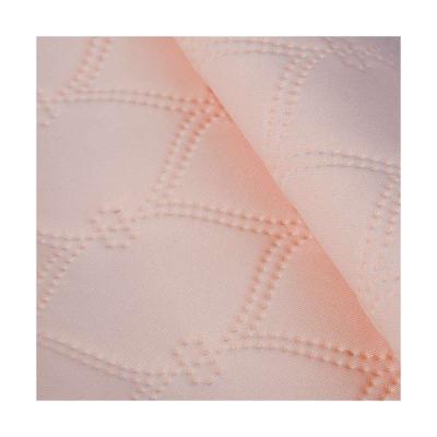 China Wrinkle Resistant Economic Custom Design Pink Embossed Thermal Stocklots Plain Knit Fabric for sale