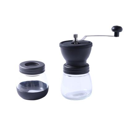 China Ceramic Burr Two Glass Jars Hand Held Coffee Grinder Household Manual Silicone Bean Cup Coffee Grinder Hand for sale