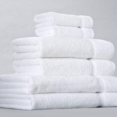 China Compressed luxury 100% cotton compressed white hotel bath toalla water-absorbent towels for sale