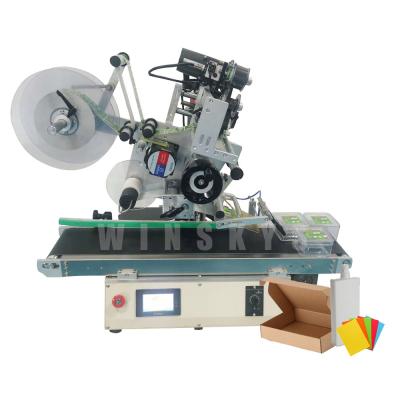 China Commodity etiquetadora semiautomatic flat etichettatrice semiautomatica put label on candle tinting labeling machine clothing for sale