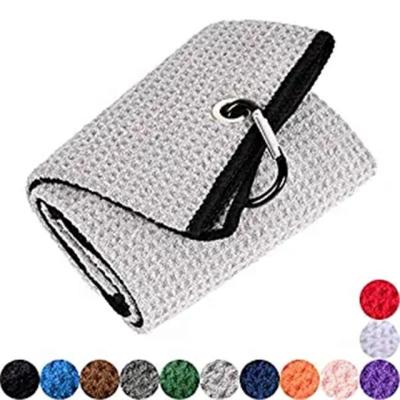 China Triple Compressed Goft Towel With Staple Resistant Microfiber Waffle Golf Towel With Pocket for sale