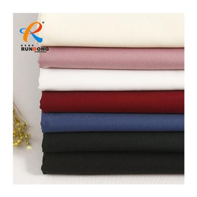 China Shink-resistant finish 100% polyester gabardine twill fabric waterproof textile cheap wholesale manufacture in shock for sale