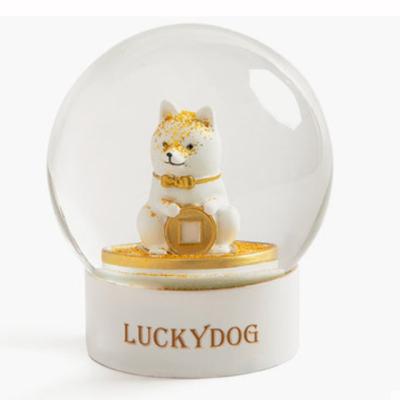 China Europe 2020 Customized Lucky Dog Snowball Christmas Snow Globe With Santa Claus Elk Crystal Ball Snow New Year Gifts for sale