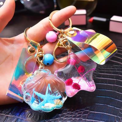 China Fashion Personalized Plastic Starfish Shell Shaped Liquid Keychains Floating Gift Key Chain for sale