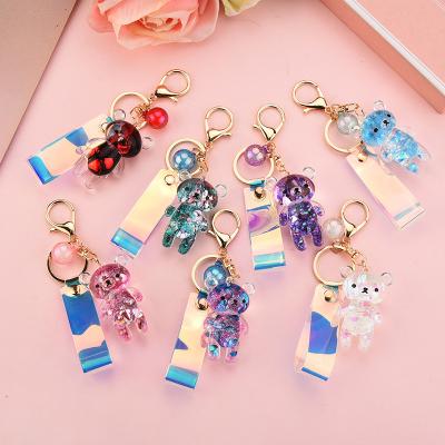 China Cute Crystal Bear Keychain Acrylic Liquid Symphony Laser Rope Leather Plastic Quicksand Key Chain for sale