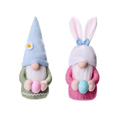 China Holiday Decorations 2022 New 35*13cm Easter Bunny Holding Egg Doll Easter Bunny Gnome Ornament Decoration for sale