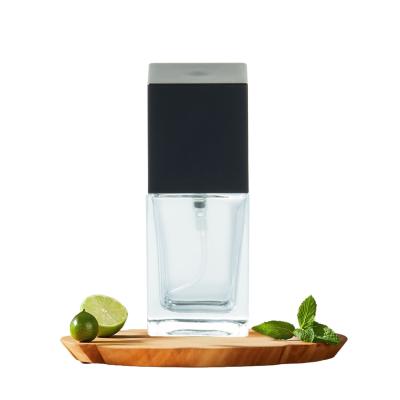 China 30ml Square Foundation Bottle Empty Clear Glass With Black Plastic Cap for sale