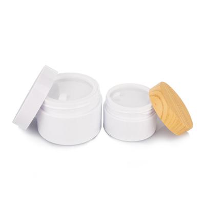 China 120ml cylindrical white Smooth Plastic Bottle With bamboo Lid For Empty Cream Jar for sale