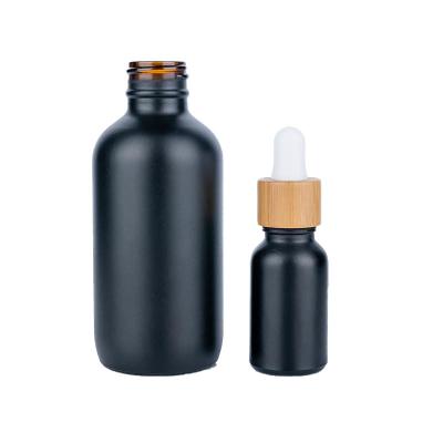 China 50ml Black Cylindrical frosted Glass Bottle With bamboo Drop For Empty Dropper Bottle for sale