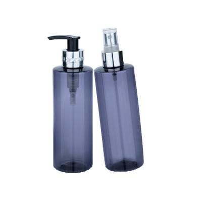 China 250ml Plastic blue transparent smooth cylindrical bottle with silver pump/spray for empty oil cosmetic bottle for sale