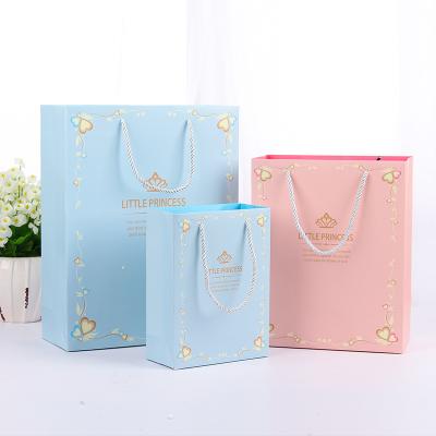 China Recycled Materials Paper Bag Custom Ribbon Handle Black Luxury Bags For Clothing Shopping Packaging Art Paper Bag For Clothes for sale