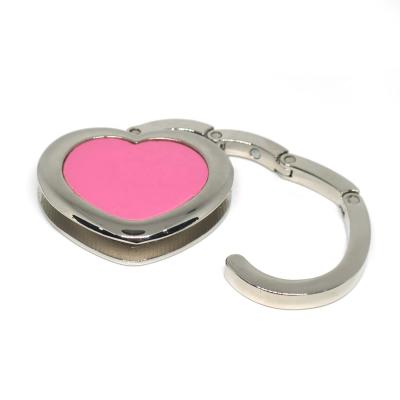 China Custom Bag Hook Heart Shape Silver Plated Bag Hanger With Rose Color Custom Bag Hook On Desk for sale