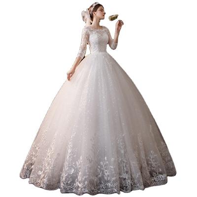 China 2021 new anti-static hot style hot sale deep V neckline tail lace short sleeve champagne color wedding dress for sale