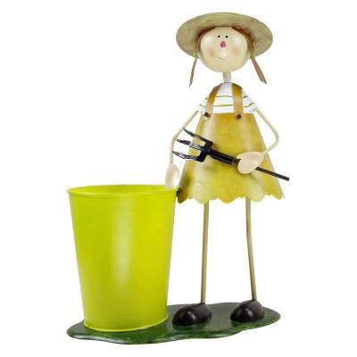 China Durable Eco-friendly Outdoor Wrought Iron Metal Craft Plant Boy And Girl With Flowerpot For Garden Decoration for sale