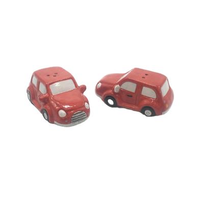 China Sustainable Red Car Shaped Shakers Ceramic Hand Made Salt And Pepper Salt And Pepper Shaker Funny Set for sale