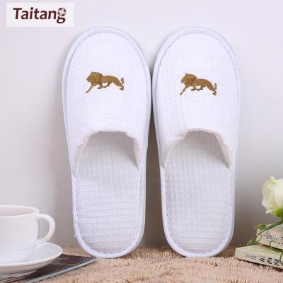 China Traveling Spa Taitang Logo Disposable Waffle Hotel Custom Home Hotel Slipper for sale