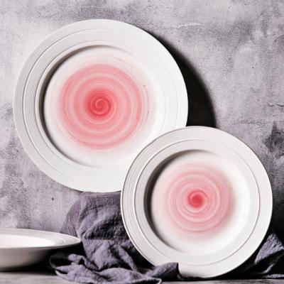 China Viable latest design wholesale pink china dinner charger swirl dishes for wedding for sale