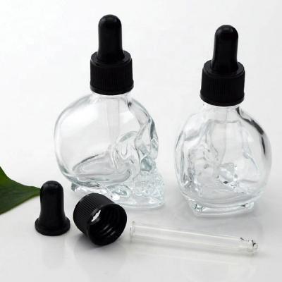 China Personal Care E-Liquid 1 Ounce 30ml Skull Clear Glass Dropper Bottle For Smoking Oils for sale