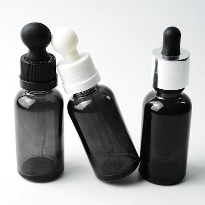 China Personal Care 30ml Essential Oil Personal Care Cosmetic Round Black Glass Bottle for sale