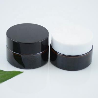 China Eco-friendly Eye Face Body Cream Skin Care Round Container 20G 20ML Brown Glass Jar With Lid for sale