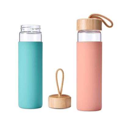 China Bamboo Lid 550ml Sustainable Silicone Sleeve Durable Borosilicate Glass Water Bottle for sale