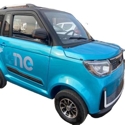 China Newest Cloth Popular Right Hand Drive 4 Seaters Electric Car Vehicle Chinese Adult City Mini Electric Car for sale