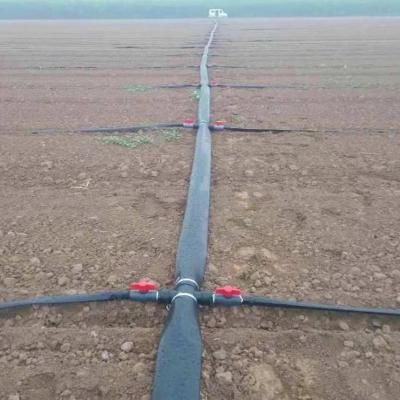 China Plastic HDPE Pipe Irrigation Drip Tape System With Flat Drip Device for sale