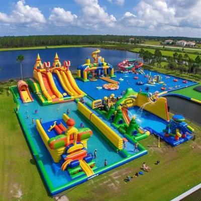 China Land Inflatable Water Park With Big Slides And Floating Toys for sale