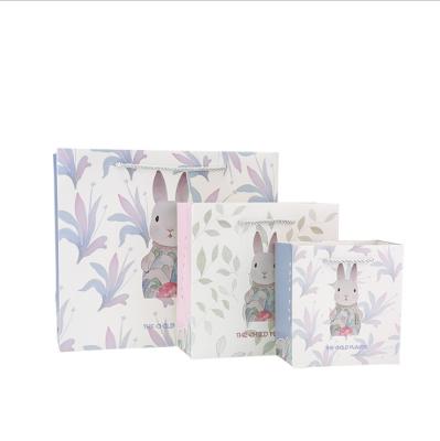 China Customized Recycled Materials White Mini Gift Paper Bags With Cute Design Printed Shopping Paper Bag for sale