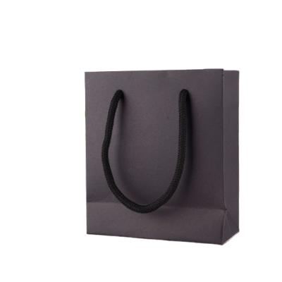 China Eco-friendly Material Custom Design Logo Retail Store Gift Paper Packaging Bag Black Paper Shopping Bag for sale