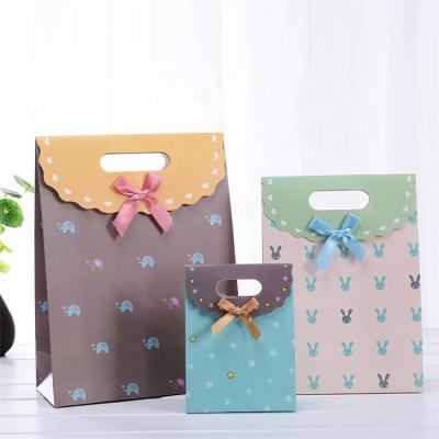 China Recyclable Custom Food Grade Ribbon Paper Gift Bag For Wedding Gift for sale