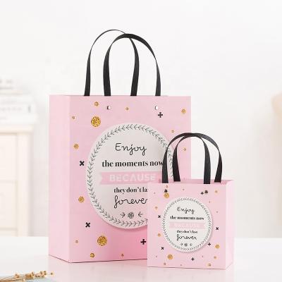 China Firm Ready To Ship Customized Shopping Pink Paper Gift Paper Handbag With Metal Button for sale