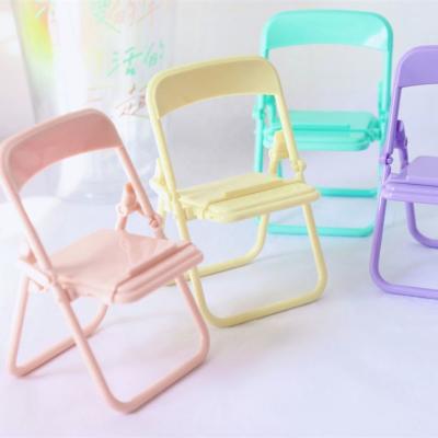 China New Creative Folding Multifunctional Cute Phone Stand Chair Shape Decoration Mobile Phone Holder Folding Desk Stands for sale