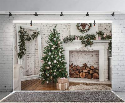 China Birthday Party Merry Christmas Room Background Christmas Tree Pine Branches Weave Fireplace Rustic Brick Wall Stack Sofa Wood Rug for sale