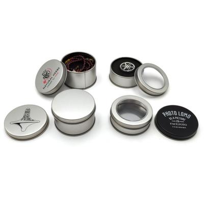 China Silver Food Grade 2oz 4oz 6oz Headphone Watch Gift Packaging Metal Round Canisters With Clear Top Lids for sale