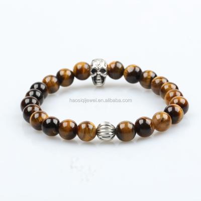 China Hot Sale Trendy Natural Brown Tiger Eye Stone Bead With Skull Charm Bracelet for sale