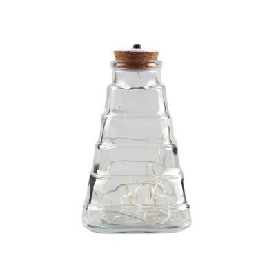 China Gift & Decorative Craft Gift Bottle Christmas Tree Shaped Clear Glass Bottle With LED Light Caps for sale