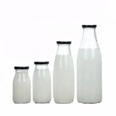 China Empty Glass Beverage Beverage Bottle 200ml 250ml 500ml 1000ml With Lid For Milk for sale