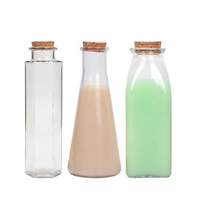 China Eco - Friendly Reusable 350ml Cylinder Softer Glass Bottle For Beverage Juice With Cork for sale