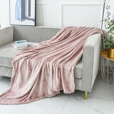 China Folded Processing Custom Double Sided Flannel Tassel Ball Edge Sofa Blanket Gift Air Conditioning Blanket for sale