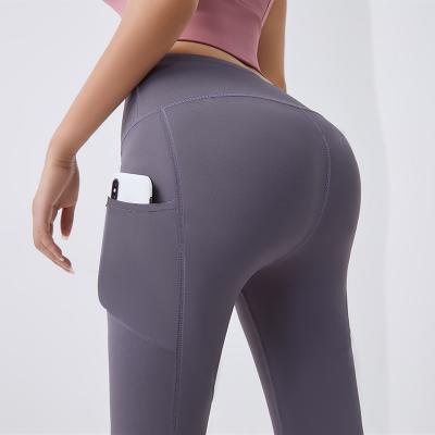 China Factory Sales Modern Design Yoga Gaiters Woman Hot Yoga Pants Breathable With Pockets Workout Running Sportswear for sale