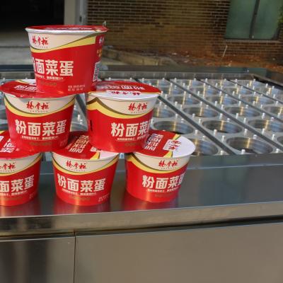 China Beverage Instant Noodles Barreled Mala Cup Noodle Filling and Seal Machine for sale