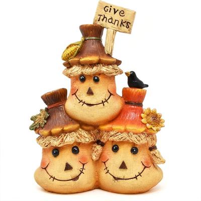 China Adorable indoor and outdoor decoration give thanks resin decorative advertising scarecrow bag figurine decorative scarecrow for sale