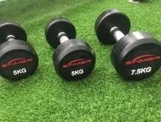 China Cabeza redonda Dumbbells de hierro fundido juego de barra olímpica 25kg 50kg en venta