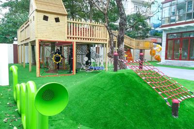 China Kindergarten wooden tree house outdoor playground equipment with climbing net for sale