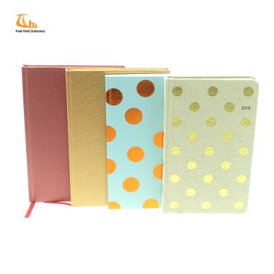 China Custom canvas hardcover purchase canvas cover printed undated a5 gold foil notebook planner for sale