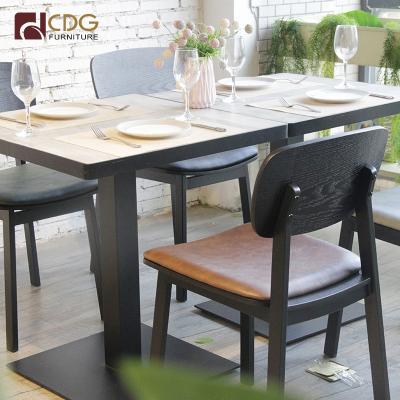 China Wooden Leather Cafes 1Comfortable Cafe Table and 2 Chairs Set Restaurant Furniture for sale