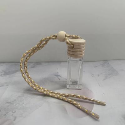 China Empty Personal Care Factory Sale Wooden Screw Top 6ml Glass Diffuser Car Perfume Hanging Bottle for sale